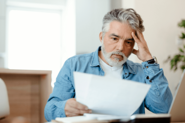 man reading a bill